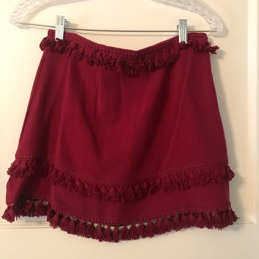 Red tassel accented skirt